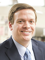 New publisher Jason Brummond poses for a portrait inside the Daily Iowan newsroom on Monday, March 27, 2017. Brummond previously worked at the Iowan as sports reporter, sports editor, and finally editor in chief in 2008. (The Daily Iowan/James Year)