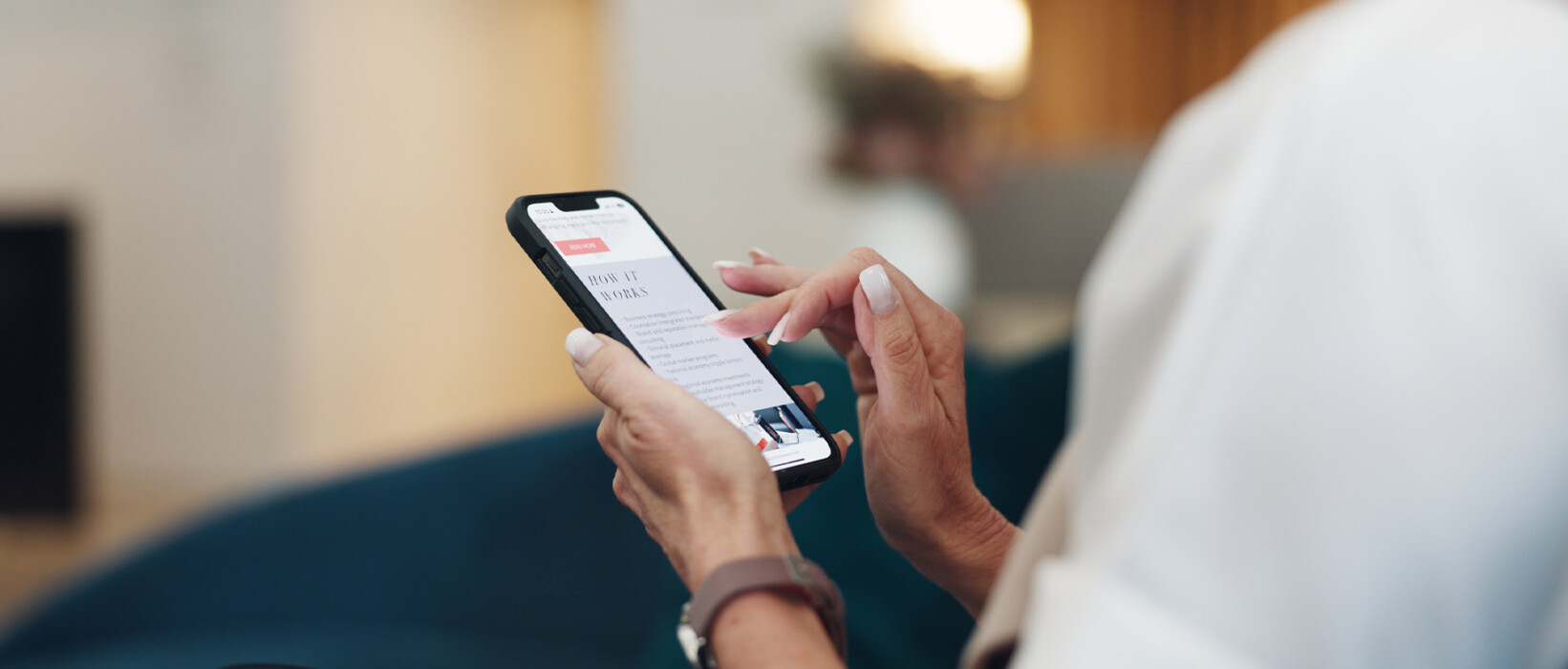 Person browsing advertising content on a smartphone.