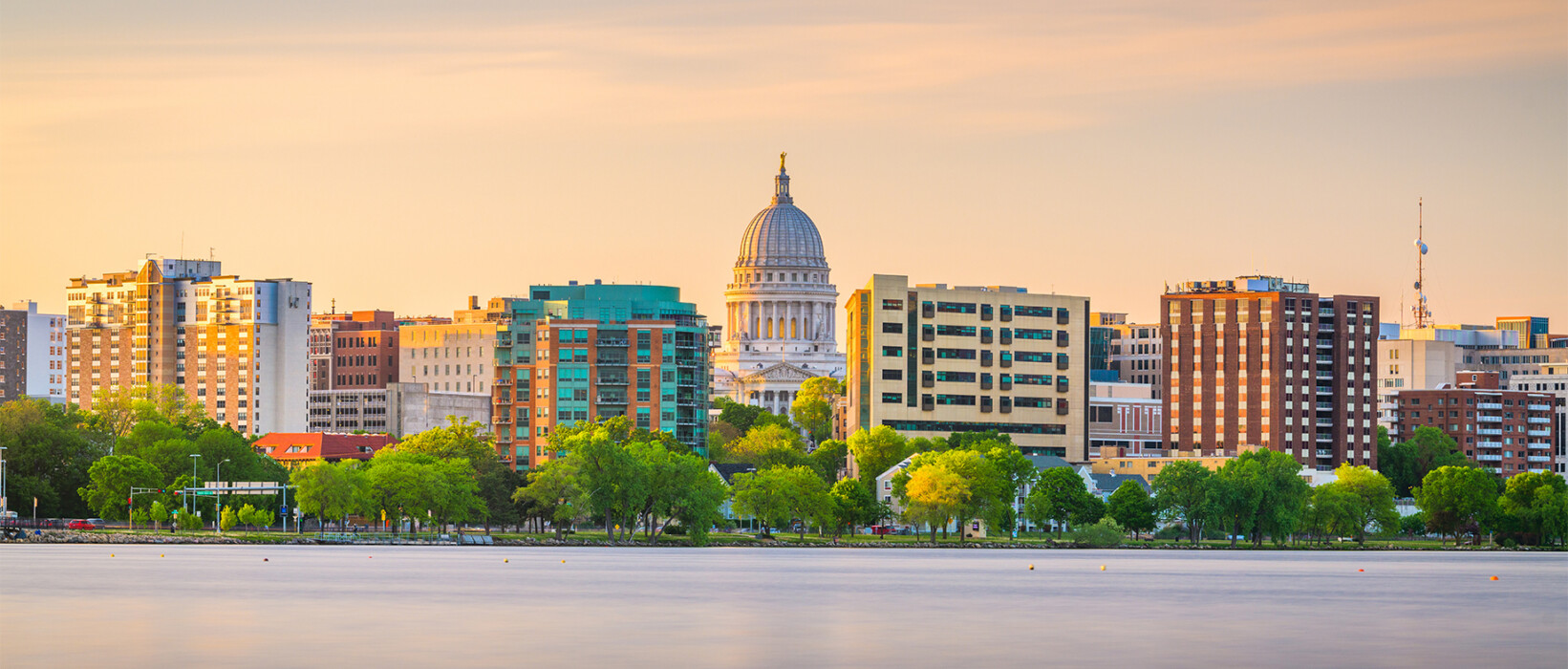 Madison skyline with the Wisconsin State Capitol along the lakefront.